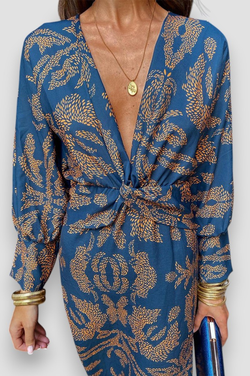 Elegante midi-jurk met twist-detail en bloemenpatroon – Tijdloos en stijlvol