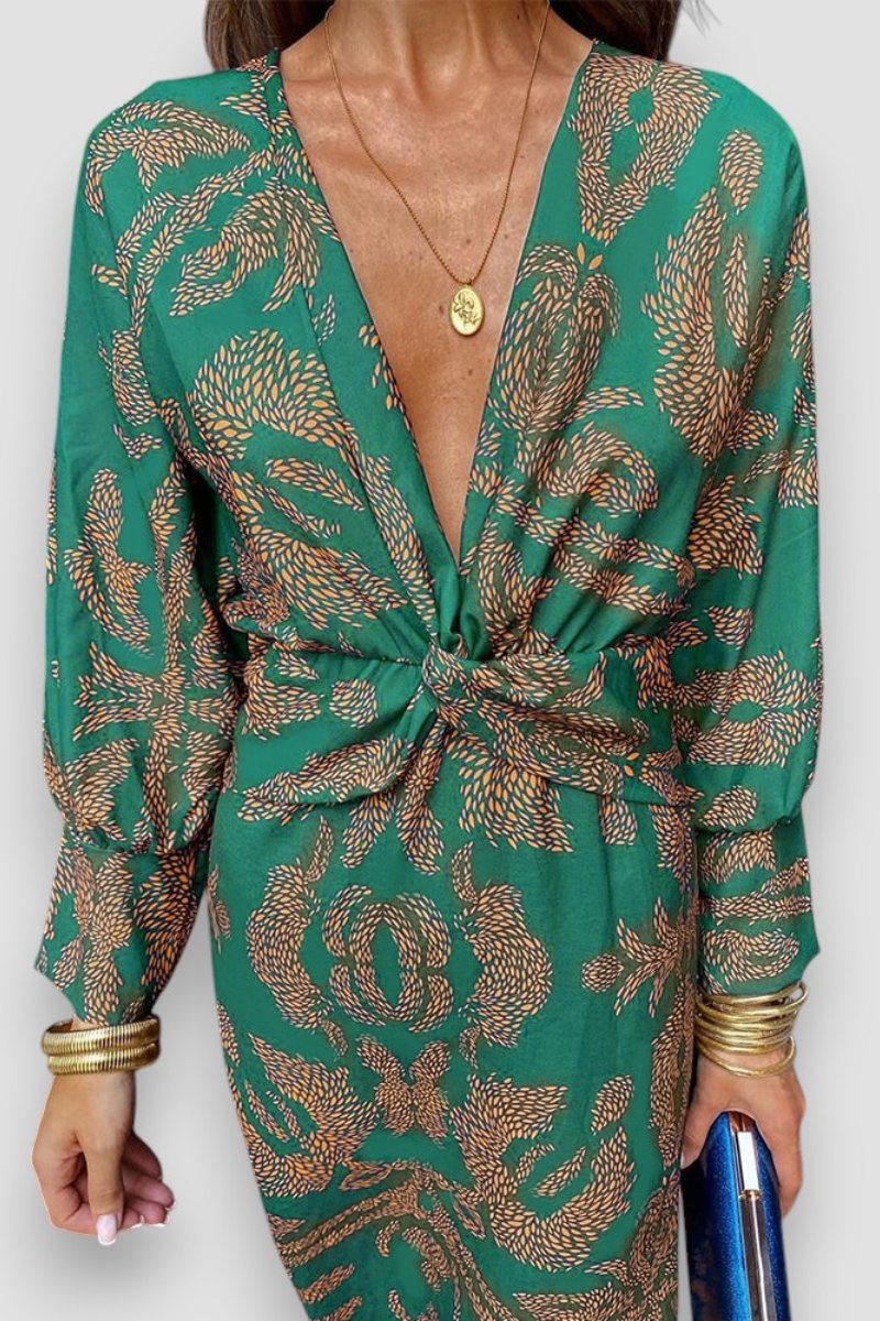 Elegante midi-jurk met twist-detail en bloemenpatroon – Tijdloos en stijlvol